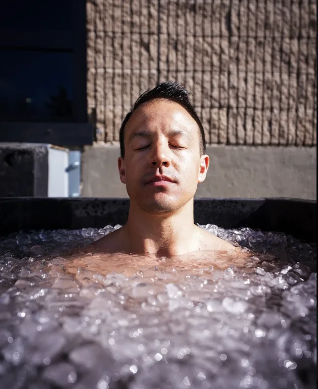 Client in an ice bath during a contrast therapy session at Arsenal Health