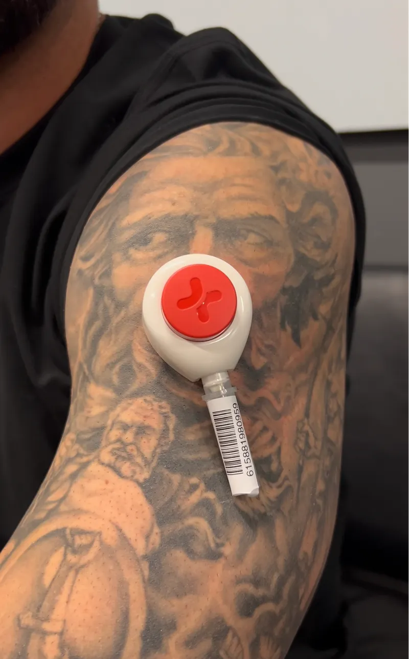 At-home blood collection device worn on an upper arm